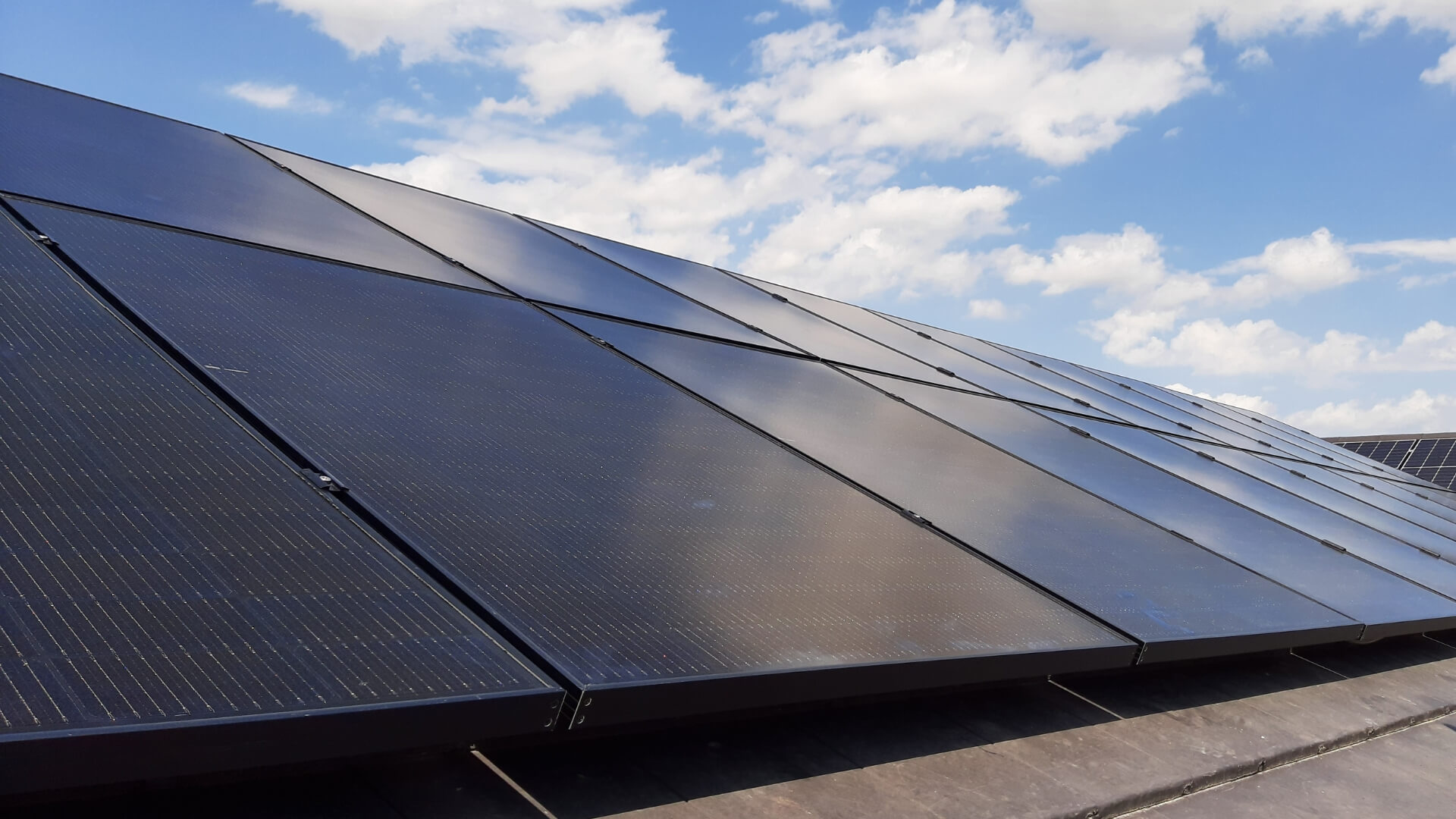 Close-up bivalent PVT system on private house roof in Regensburg