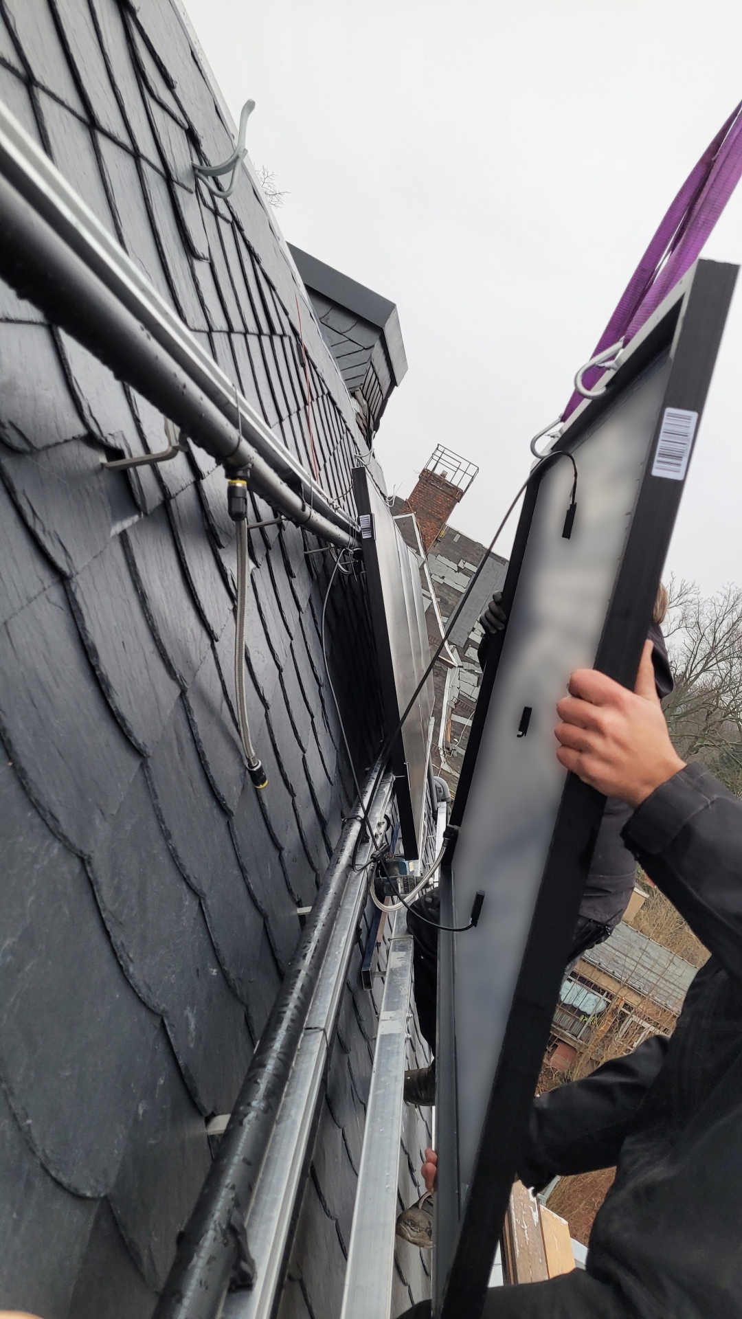 PVT module installation process on slate roof