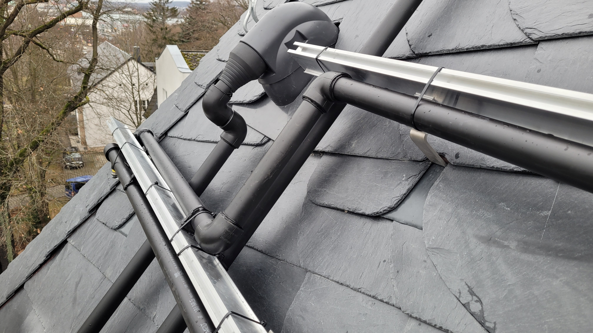 PVT system on slate roof mounting and piping closeup