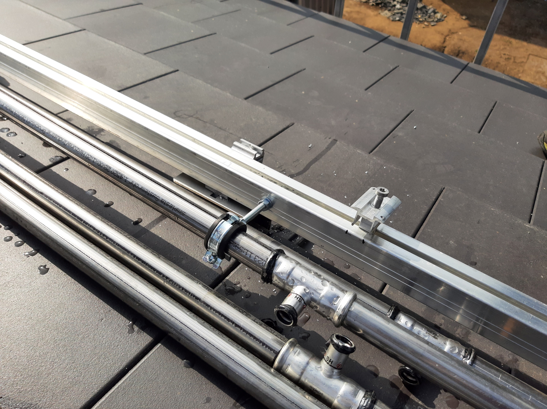 PVT mounting and stainless steel piping on roof